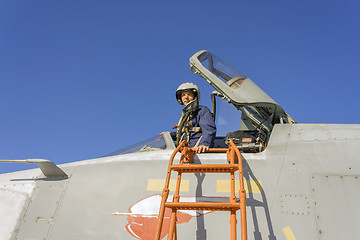 Image showing Military pilot in the cockpit of a jet aircraft