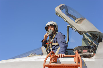 Image showing Military pilot in the cockpit of a jet aircraft