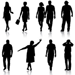 Image showing Set black silhouettes of beautiful man and woman on white background. illustration