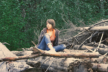 Image showing Young Woman Sitting In The Forest