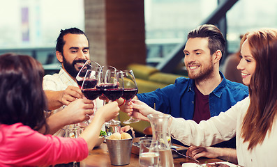 Image showing friends dining and drinking wine at restaurant