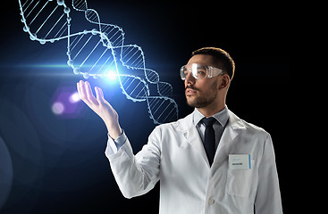 Image showing scientist in lab coat and safety glasses with dna