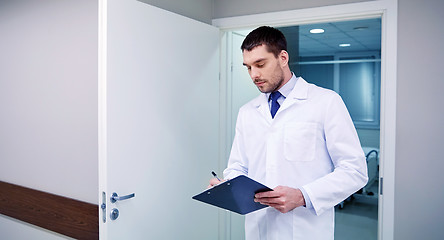Image showing doctor with clipboard at hospital