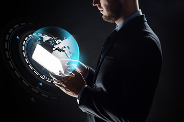 Image showing close up of businessman with transparent tablet pc