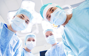 Image showing group of surgeons in operating room at hospital