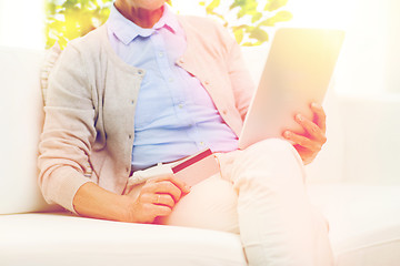 Image showing senior woman with tablet pc and credit card