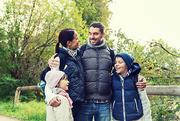 Image showing happy family with backpacks hiking