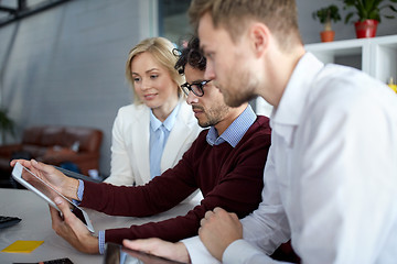 Image showing business team with tablet pc at office