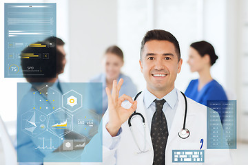 Image showing happy doctor showing ok hand sign at hospital