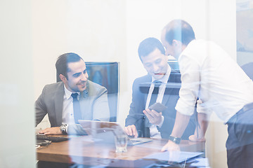 Image showing Cheerful relaxed corporate businessteam working in modern office.