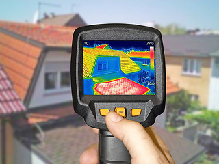 Image showing Recording Warmed roofs on family homes with thermal camera