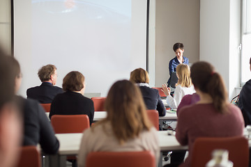 Image showing Woman giving presentation in lecture hall at university.