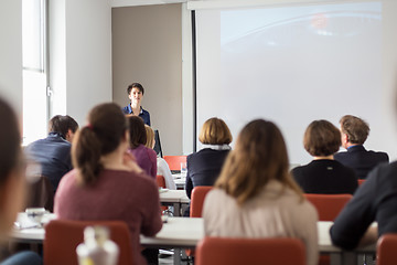 Image showing Woman giving presentation in lecture hall at university.