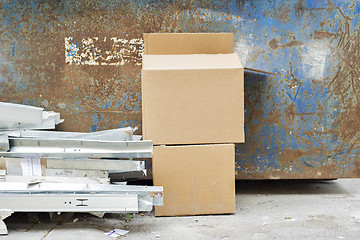 Image showing Construction wastes near the metal garbage container