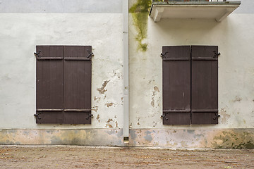 Image showing abandoned grunge house with closed shutters