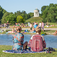 Image showing People tanning, swimming and enjoying the summer in Englischer Garten in Munich, Germany.