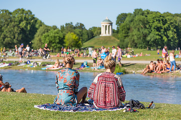 Image showing People tanning, swimming and enjoying the summer in Englischer Garten in Munich, Germany.