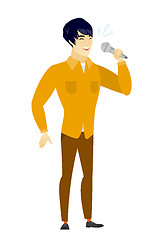 Image showing Asian businessman singing to the microphone.