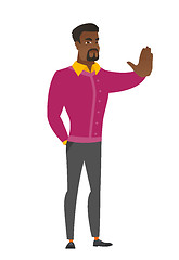 Image showing African businessman showing stop hand gesture.