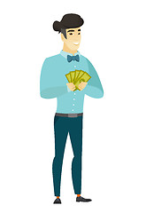 Image showing Happy asian businessman holding money.