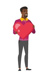 Image showing African business man holding a big red heart.