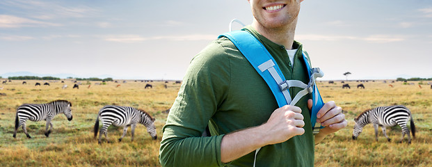 Image showing close up of happy man with backpack traveling