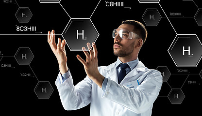 Image showing scientist in lab goggles chemical formula