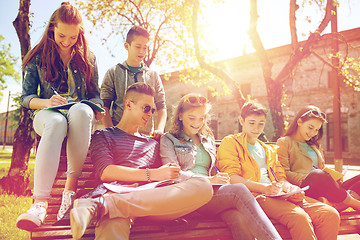 Image showing group of students with notebooks at school yard