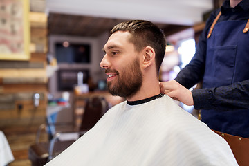 Image showing hairdresser and man with beard at barbershop