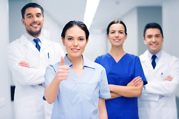 Image showing medics or doctors at hospital showing thumbs up