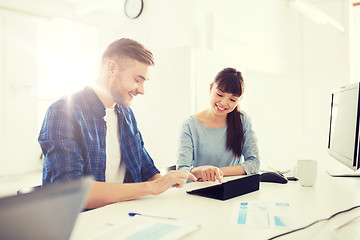 Image showing creative team with tablet pc and papers at office