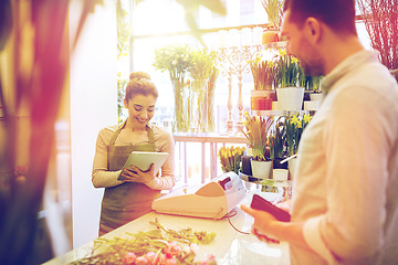 Image showing florist woman and man making order at flower shop