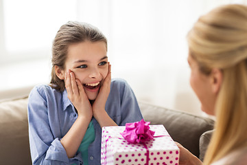 Image showing mother giving birthday present to girl at home