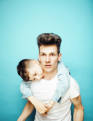 Image showing young pretty man model with little cute son playing together, lifestyle modern people concept, family male 