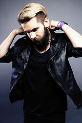 Image showing portrait of young bearded hipster guy on gray dark background close up, brutal modern man, lifestyle people concept 