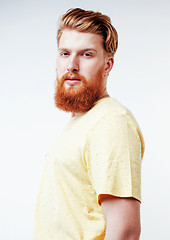 Image showing young handsome hipster ginger bearded guy looking brutal isolated on white background, lifestyle people concept