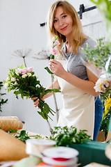 Image showing Smiling florist in flower shop