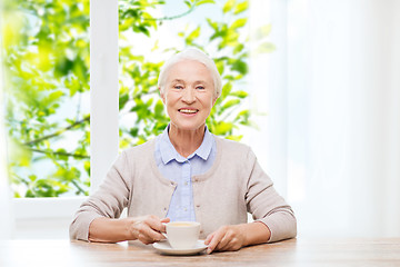 Image showing happy senior woman with cup of coffee