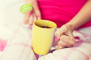 Image showing close up of young woman with tea cup