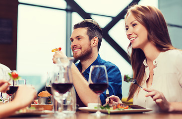 Image showing happy couple having dinner at restaurant