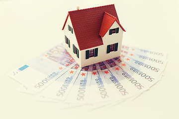 Image showing close up of home or house model and money