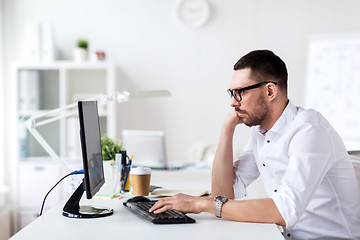 Image showing businessman typing on computer keyboard at office