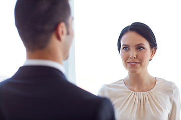 Image showing smiling business man and woman at office