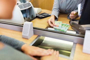 Image showing clerk counting cash money at bank office