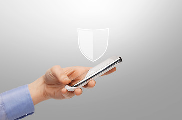 Image showing woman with smartphone and antivirus program icon
