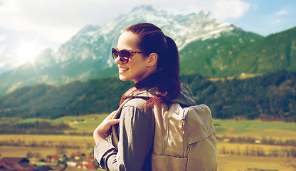 Image showing happy woman with backpack traveling in highlands