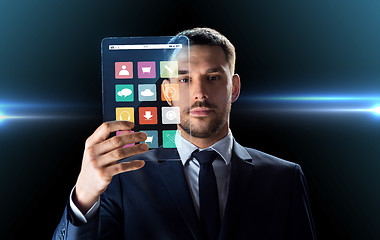 Image showing businessman working with transparent tablet pc