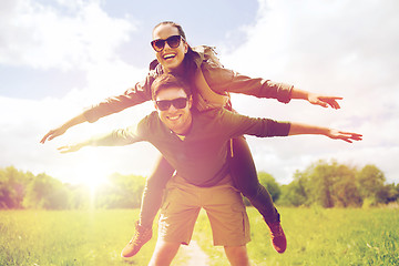 Image showing happy couple with backpacks having fun outdoors