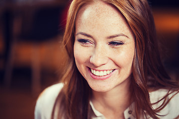 Image showing smiling happy young redhead woman face