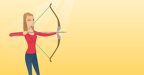 Image showing Young caucasian archer training with a bow.